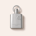 Flakon Afnan Supremacy Silver EDP 100 ml na pudrově růžovém pozadí – MrRizz