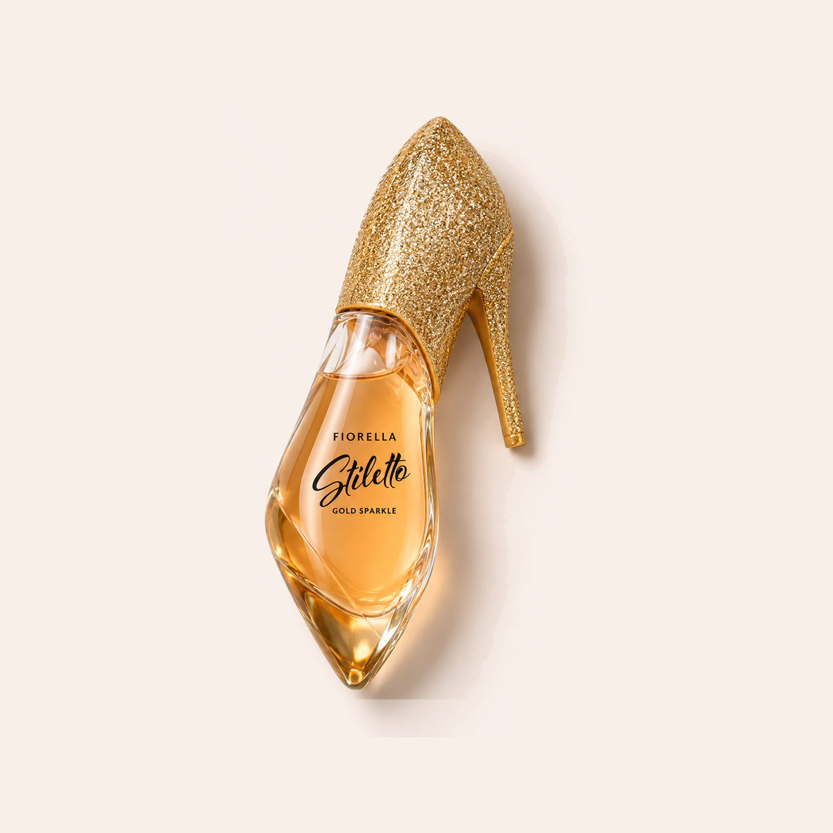 Flakon Marc Dion Fiorella Stiletto Gold Sparkle EDP 100 ml na pudrově růžovém pozadí – MrRizz