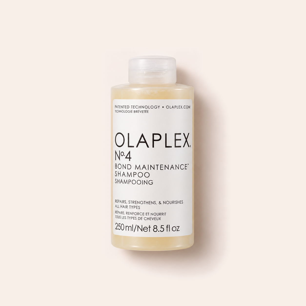 Šampon Olaplex No.4 Bond Maintenance 250 ml na béžovém pozadí – MrRizz