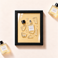 Ilustrační parfémový obraz Essential Parfums Divine Vanille z fragmentů originálního flakonu v černém rámu
